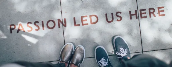 students standing over slogan
